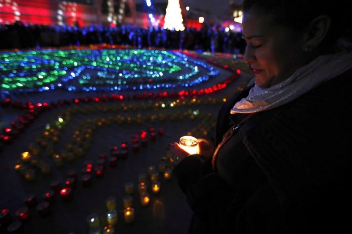 Moteris su žvake Madride / EPA nuotr.